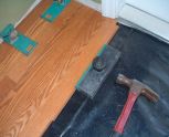 Harmonics laminate flooring installation, I installed a couple of rows into the hallway from the living room. This is the other end of the hallway