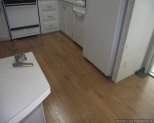 Pergo XP laminate flooring Begining of installation into Kitchen from the dining room.