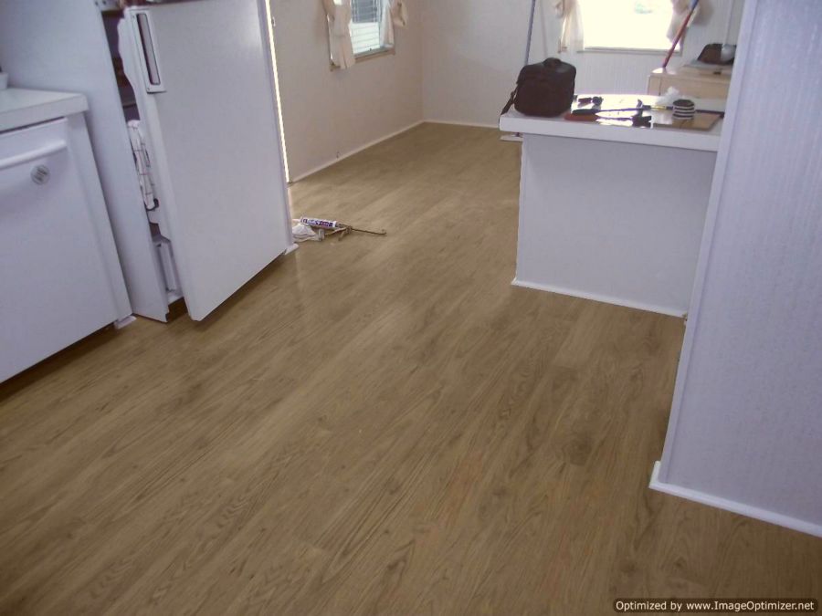 Pergo XP laminate flooring installed in kitchen and dining room.