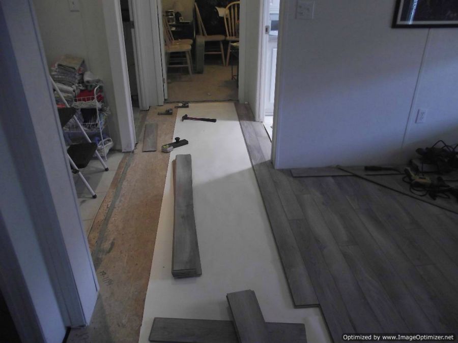 Nirvana V-groove laminate flooring installation, doing hallway installation around corner