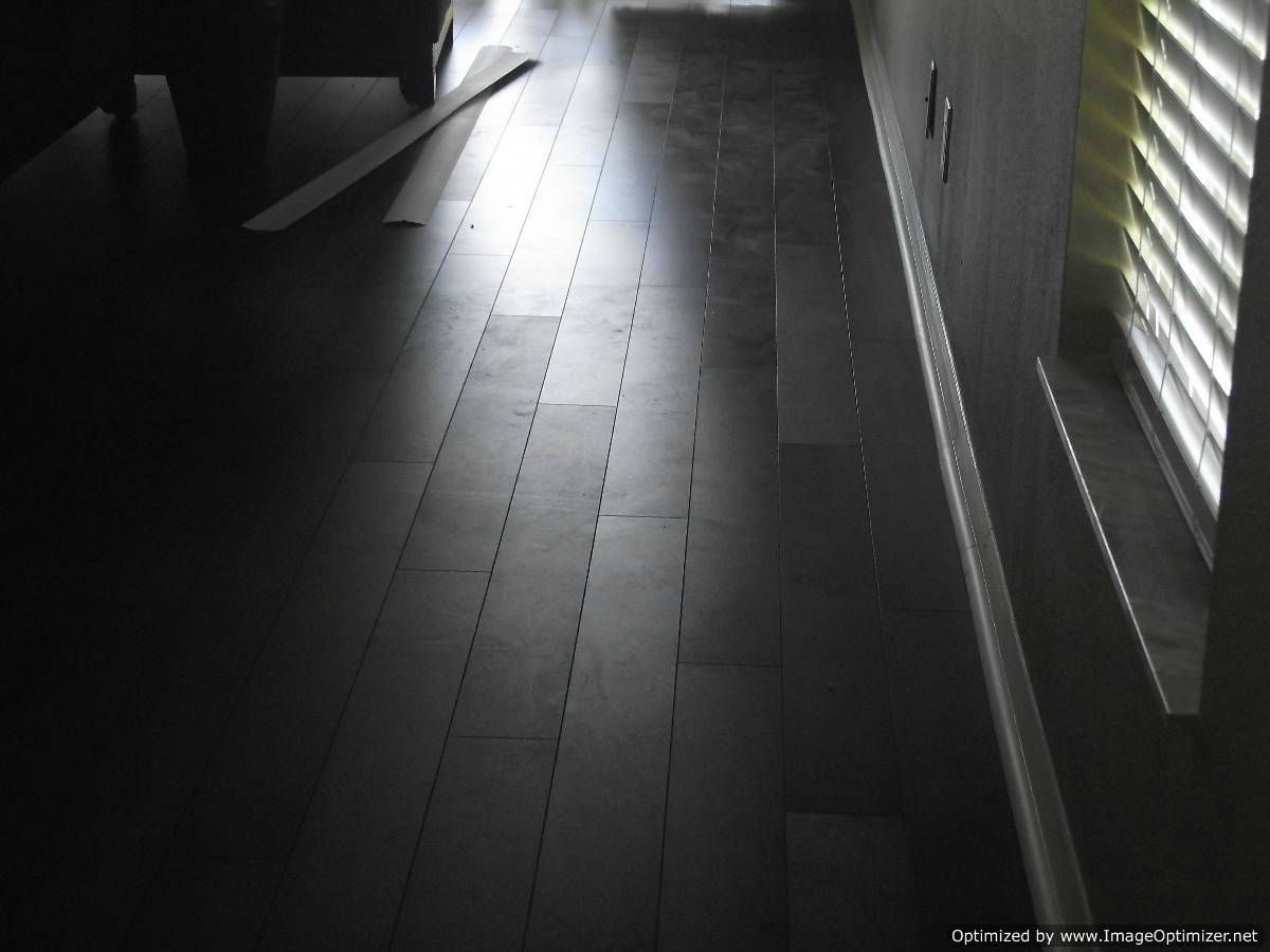 Lamton Virginia walnut laminate flooring, showing defect on the finish