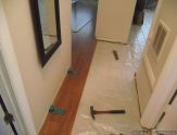 Harmonics laminate flooring installation, I installed a couple of rows into the hallway from the living room