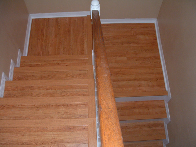 Finished stair case done with laminate flooring