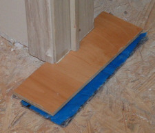 A sample of laminate and uderlayment for checking the height  when cutting your door casing