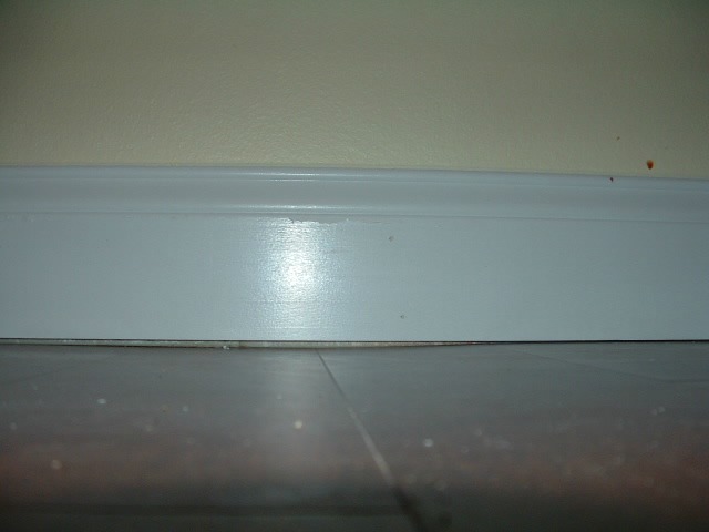 Use the pry bars to pry the baseboard away from the wall so you will not push in the drywall