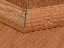 Here is a poor example of quarter round installed. The gap in the photo is the result of cutting at the wrong angles. 