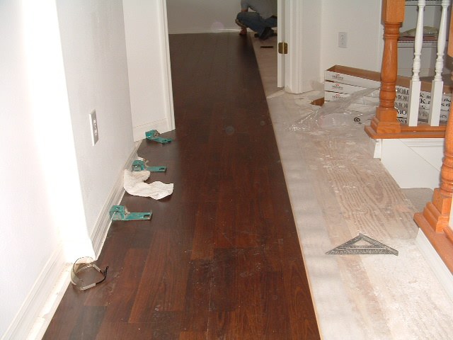 Lowes Mohawk laminate flooring installing in hallway