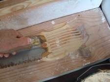 I am using a wood glue to glue the laminate flooring tread down as I install laminate flooring on these stairs.