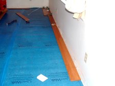 Here I'm starting the first row of Vanier laminate flooring