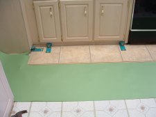 Installing the first row of laminate tile