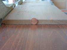 14 mm Toklo laminate flooring compared to a penny