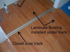 Installing laminate flooring in closet underneath the closet door track
