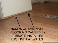 Bad Laminate flooring installation shows the floor peaking up 