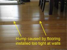 Hump on laminate flooring from being too tight against walls