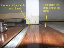 Allen & Roth laminate flooring being installed.in a small kitchen, 10Mm from Lowes 