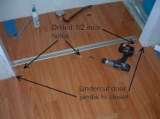 Installing laminate flooring under closet door track