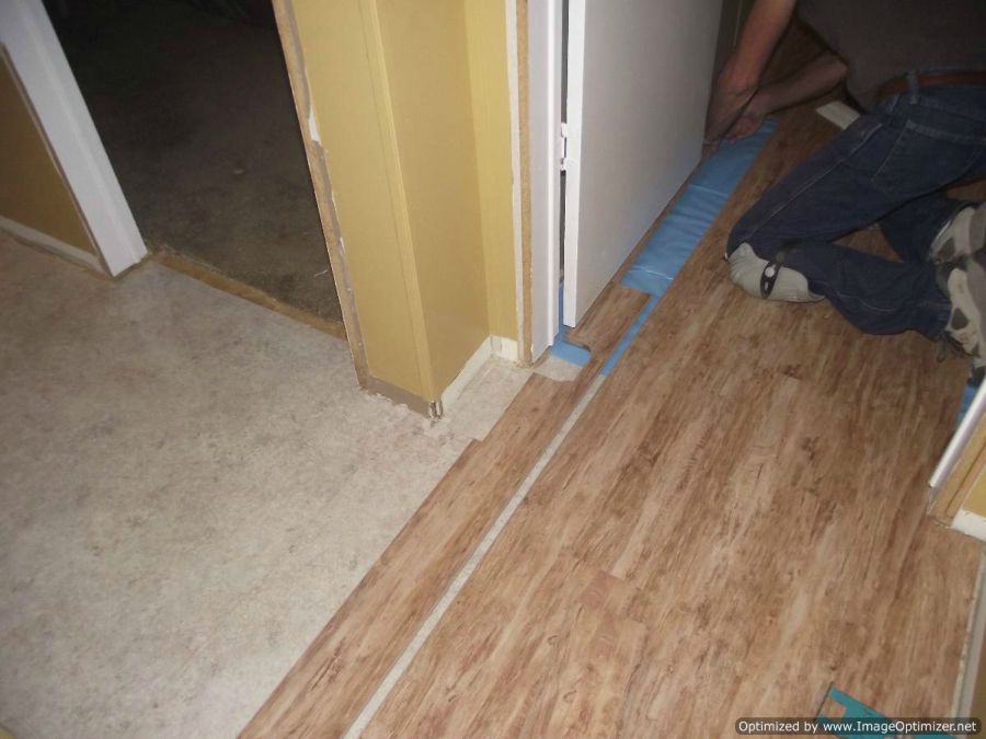 Dream Home, Kensington Manor 12mm laminate flooring Texture close up installing under a door jamb