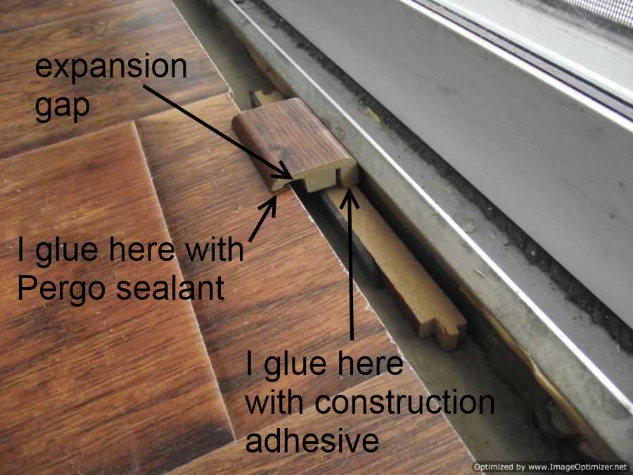Laminate Transitions At Sliding Doors, How To Lay Laminate Flooring Around Metal Door Frames