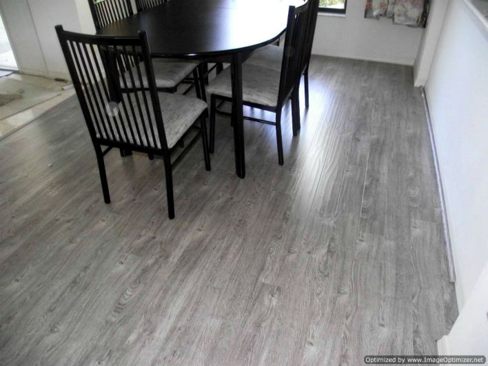 Shaw Gray laminate flooring installed in dining room