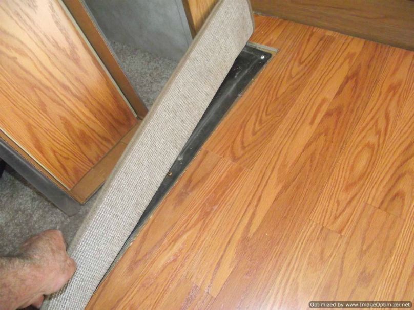 Installing laminate flooring in a travel trailer, up to the slide out 