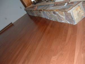 Undercutting a fireplace to install laminate or hardwood flooring under it.