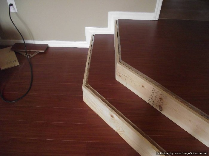 Installing laminate flooring on angled stairs, after the laminate tread is glued and the top landing installed, the stair nose can be installed.