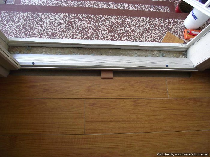 Installing transition for laminate at entry door