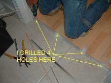 Here I drill 4 holes for the laminate transition track