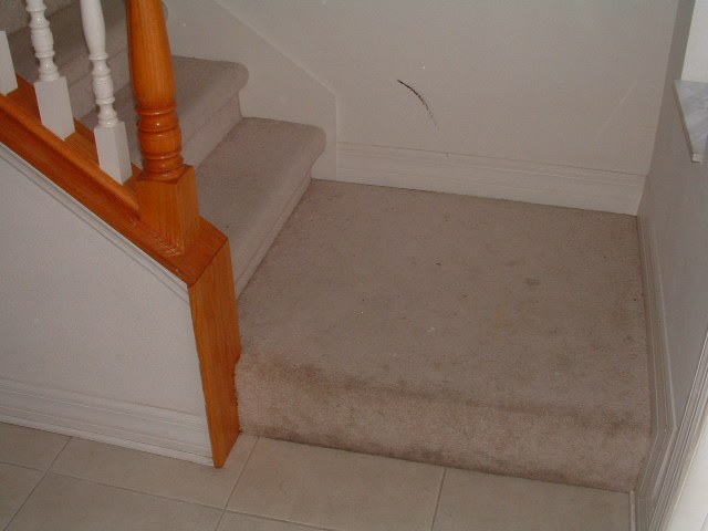 Before Lowes Mohawk laminate flooring installed on stairs