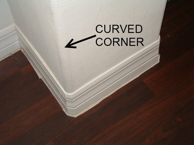 Installing quarter round on round corners,this shows the curved corner on the wall.