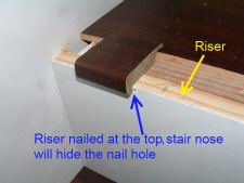 Here you can see the nail hole at the top of the riser,while installing laminate flooring on stairs.
