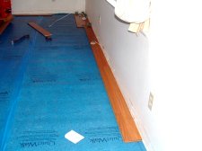 Here I'm starting the first row of Vanier laminate flooring