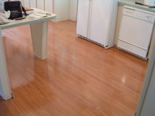 The AFTER photo with the Vanier laminate flooring installed in the kitchen
