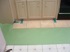 Installing the first row of laminate tile