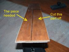 Cutting laminate around corners is easier when I install this temporary plank.