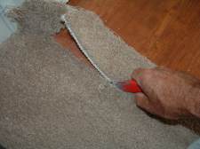 Cutting carpet at laminate transition