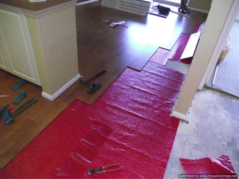 Water damaged laminate flooring,removal from hallway into living room.