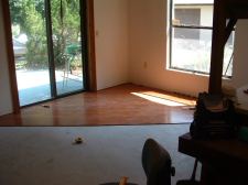 Undercutting a fireplace to install laminate or hardwood flooring under it.