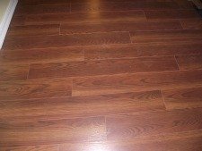 Swiftlock Plus 8MM laminate flooring from Lowes. Underlayment attached to the bottom, EastPort Oak Auburn 