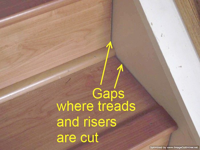 Bad laminate stair installation. It shows gaps where the treads and risers were cut to meet the sides of the stairs.
