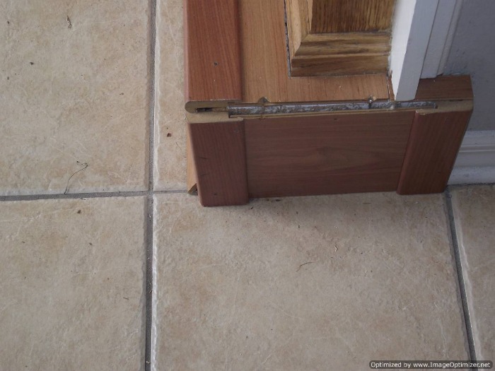 Bad laminate stair installation. It shows gaps where the treads and risers were cut to meet the sides of the stairs.