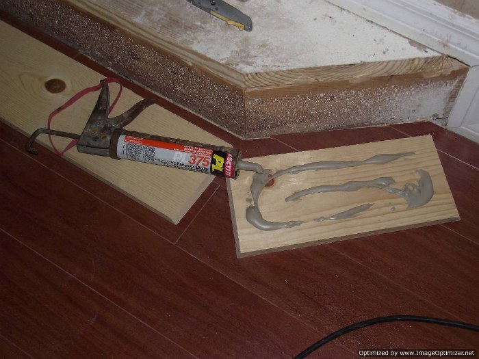 Installing laminate flooring on angled stairs, position the stair nose on the riser so it sits level.