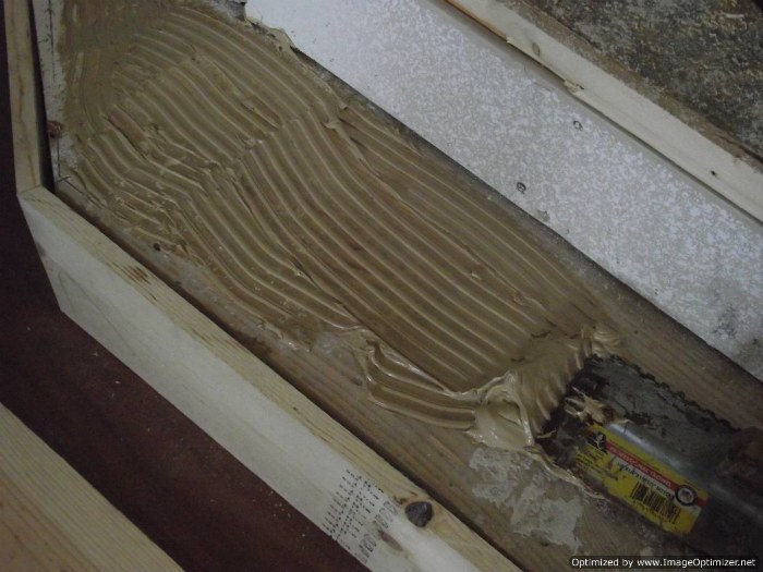 Installing laminate flooring on angled stairs, after cutting the laminate tread, spread some wood glue so you can glue the laminate stair tread down.