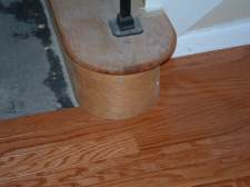 Installing laminate or hardwood around a curved staircase.