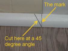 Make a mark where the 45 degree cut will be made for the return on the quarter round.